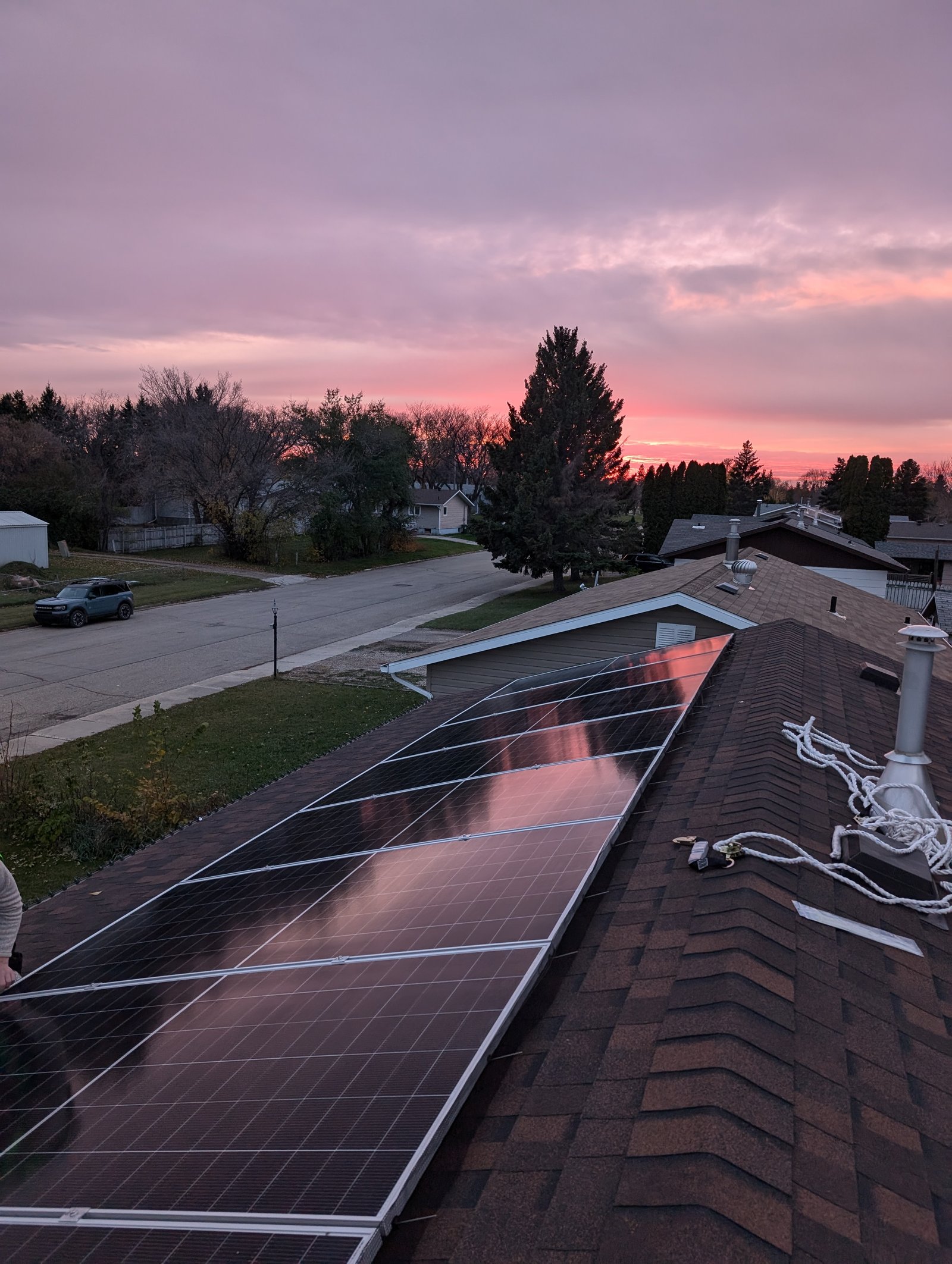 Rooftop solar installation at sunset in Saskatchewan